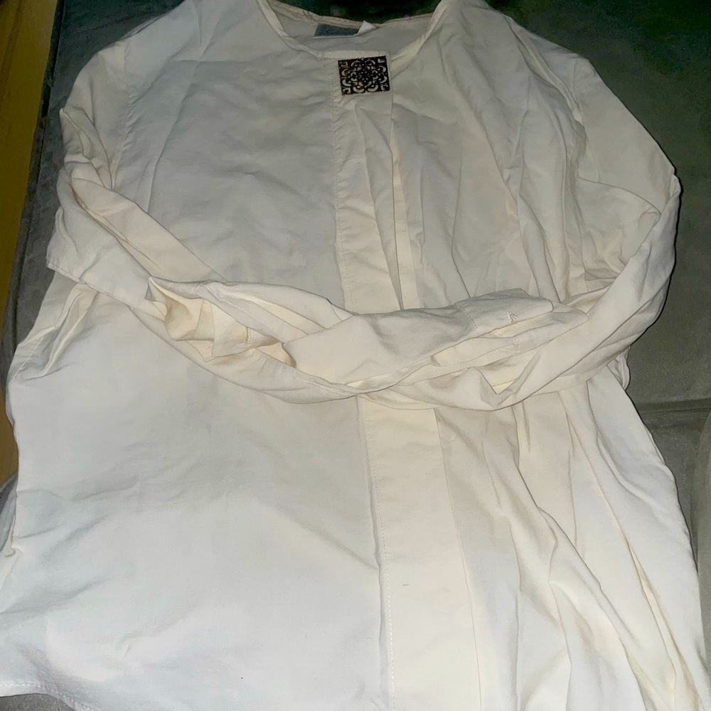 Long sleeve dress shirt with designed top button